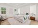 Cozy bedroom boasts neutral tones, natural light, and a comfortable sitting area at 525 Kings Lake Way, Durham, NC 27703