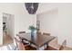 Elegant dining room with stylish lighting, seating for six, and ample natural light at 525 Kings Lake Way, Durham, NC 27703