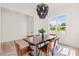 Well-lit dining room with a large window, seating for six, and modern decor at 525 Kings Lake Way, Durham, NC 27703