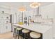 Elegant kitchen island with bar stool seating, modern stainless appliances, and ample counter space at 525 Kings Lake Way, Durham, NC 27703