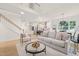 Spacious living room with an open concept design and hardwood floors at 525 Kings Lake Way, Durham, NC 27703