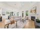 Bright living room featuring a fireplace, high ceilings, and an open floor plan at 525 Kings Lake Way, Durham, NC 27703