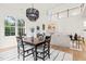 Bright living space features an open concept floor plan, fireplace, stairs to second floor, and an eat-in kitchen at 525 Kings Lake Way, Durham, NC 27703