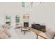 Inviting living room featuring neutral decor, fireplace and abundant natural light at 525 Kings Lake Way, Durham, NC 27703