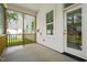 Covered porch with painted floors and views of fenced backyard at 525 Kings Lake Way, Durham, NC 27703