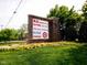 Shopping center sign displaying popular retail stores including BJs, TJ Maxx, and Staples at 525 Kings Lake Way, Durham, NC 27703