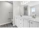 Large on-suite bathroom featuring a double vanity and modern finishes at 5309 Neuse Wood Dr, Raleigh, NC 27616