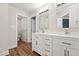 Bathroom featuring a double sink vanity with ample storage space at 5317 Moonflower Ct, Holly Springs, NC 27540