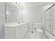 Bathroom featuring a single sink, toilet, and shower with sliding glass doors at 5317 Moonflower Ct, Holly Springs, NC 27540