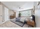Well-lit bedroom with carpet, ceiling fan, window, and desk at 5317 Moonflower Ct, Holly Springs, NC 27540