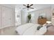 Bright bedroom with ceiling fan, window, and furniture at 5317 Moonflower Ct, Holly Springs, NC 27540