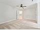 Spacious bedroom featuring carpet flooring and ample natural light, creating a comfortable retreat at 5317 Moonflower Ct, Holly Springs, NC 27540