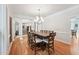 Traditional dining room with large table and crown molding at 5317 Moonflower Ct, Holly Springs, NC 27540
