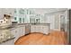 Kitchen with stainless steel appliances, granite countertops and hardwood floors at 5317 Moonflower Ct, Holly Springs, NC 27540