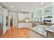Kitchen featuring granite counters, stainless steel appliances and bright natural light at 5317 Moonflower Ct, Holly Springs, NC 27540