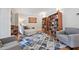 Comfortable living room showcasing a cozy seating area, stylish rug, and built-in bookcases at 5317 Moonflower Ct, Holly Springs, NC 27540