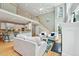 Open concept living area features hardwood floors, a fireplace, and a kitchen with a breakfast bar at 5317 Moonflower Ct, Holly Springs, NC 27540
