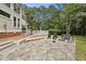 Relaxing patio with flagstone, comfortable seating, and landscaped yard creating a great outdoor space at 5317 Moonflower Ct, Holly Springs, NC 27540