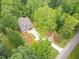 Aerial view of a beautiful home nestled among lush greenery and mature trees at 5504 Earle Road, Raleigh, NC 27606