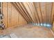 Unfinished attic space showing wood beams and plywood flooring at 5504 Earle Road, Raleigh, NC 27606