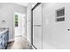 Bathroom showcases an elegant glass enclosed shower with subway tile and black trim at 5504 Earle Road, Raleigh, NC 27606