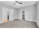 Bedroom features a walk-in closet and neutral decor at 5504 Earle Road, Raleigh, NC 27606