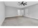 Spacious bedroom with neutral walls, carpet, and open doorway at 5504 Earle Road, Raleigh, NC 27606