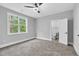 Bedroom with a view through the window and attached bathroom at 5504 Earle Road, Raleigh, NC 27606