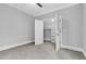Cozy bedroom features a ceiling fan and a well-organized walk-in closet with shelving at 5504 Earle Road, Raleigh, NC 27606