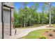 Long driveway leading to a beautiful home surrounded by lush greenery and trees at 5504 Earle Road, Raleigh, NC 27606