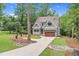 Charming two-story home with gray siding, stone accents, and a well-manicured front yard at 5504 Earle Road, Raleigh, NC 27606