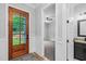 Open foyer with a view to a bedroom, and a bathroom, showcasing the floor plan and natural light at 5504 Earle Road, Raleigh, NC 27606