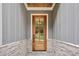 Inviting front door with glass panes and stone accents, offering a warm welcome to guests at 5504 Earle Road, Raleigh, NC 27606