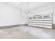 Spacious and bright garage with a clean concrete floor and overhead door at 5504 Earle Road, Raleigh, NC 27606