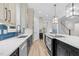 Stylish kitchen featuring custom cabinets, a large island with cooktop, and modern appliances at 5504 Earle Road, Raleigh, NC 27606