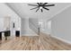 Bright, open-concept living room with hardwood floors, staircase, and open floor plan at 5504 Earle Road, Raleigh, NC 27606