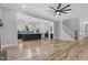 Spacious living area showcasing hardwood floors, open layout to kitchen, and staircase at 5504 Earle Road, Raleigh, NC 27606