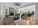 Comfortable living room with hardwood floors, fireplace, open kitchen view, and stylish furniture at 5504 Earle Road, Raleigh, NC 27606