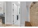 Convenient mudroom entry with coat hooks, bench and an open doorway to the kitchen area at 5504 Earle Road, Raleigh, NC 27606