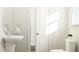 A half bathroom featuring a pedestal sink and toilet at 5545 Cayden Cove Dr, Wendell, NC 27591