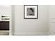 Modern hallway with stylish black and white artwork, leading to a comfortable living space at 5545 Cayden Cove Dr, Wendell, NC 27591