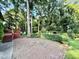 Brick patio offers a serene outdoor setting with a gazebo and lush surroundings at 5617 Partridge Ln, Raleigh, NC 27609
