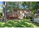 The backyard boasts a charming gazebo and wooden deck perfect for outdoor entertaining at 5617 Partridge Ln, Raleigh, NC 27609