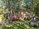 This backyard has a large wood deck, gazebo, and lots of large trees at 5617 Partridge Ln, Raleigh, NC 27609