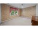 This light tan bedroom features an overhead fan and bright window at 5617 Partridge Ln, Raleigh, NC 27609