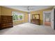 Bedroom featuring carpet, large window and views to the backyard, and wooden furniture at 5617 Partridge Ln, Raleigh, NC 27609