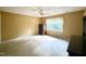 Bedroom with carpet, ceiling fan, and large window at 5617 Partridge Ln, Raleigh, NC 27609