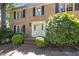 Traditional brick home featuring a white front door with side and overhead windows at 5617 Partridge Ln, Raleigh, NC 27609