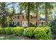 Charming two-story brick home with black shutters and a beautifully landscaped front yard at 5617 Partridge Ln, Raleigh, NC 27609