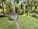 A beautiful gazebo sits in the green backyard, creating a perfect outdoor retreat at 5617 Partridge Ln, Raleigh, NC 27609